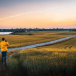 Roskilde Plant - man taking photo of grassland